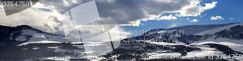Image of Panorama of winter mountains at evening