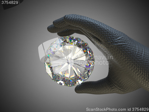 Image of Hand in glove holding huge gemstone 