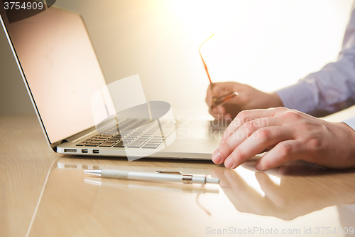 Image of The hands on the keyboard