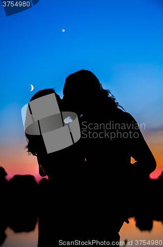 Image of Silhouette of a couple at sunset