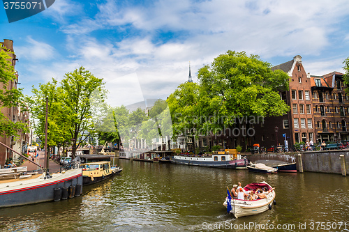 Image of Amsterdam canals and  boats, Holland, Netherlands.