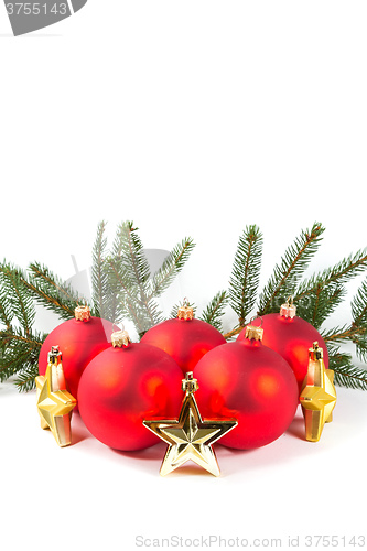 Image of red Christmas balls and fir branch