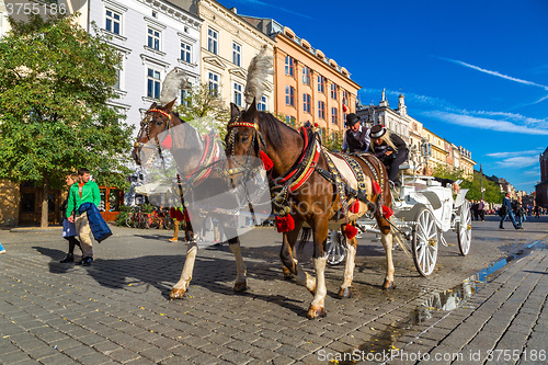 Image of Horse carriages at main square in Krakow