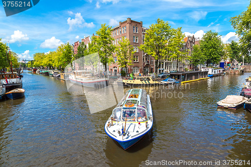 Image of Amsterdam canals and  boats, Holland, Netherlands.