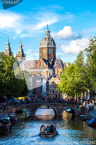 Image of Canal and St. Nicolas Church in Amsterdam