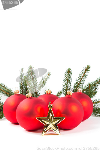 Image of red Christmas balls and fir branch