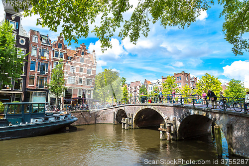 Image of Amsterdam canals and  boats, Holland, Netherlands.