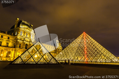 Image of The Louvre at night in Paris