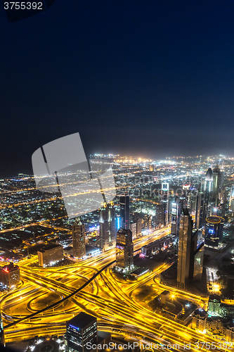 Image of Dubai downtown night scene with city lights,