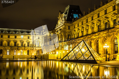 Image of The Louvre at night in Paris