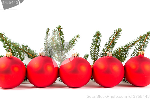 Image of red Christmas balls and fir branch