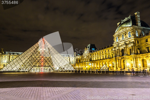 Image of The Louvre at night in Paris