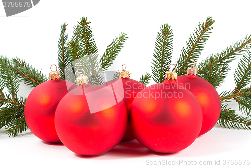 Image of red Christmas balls and fir branch