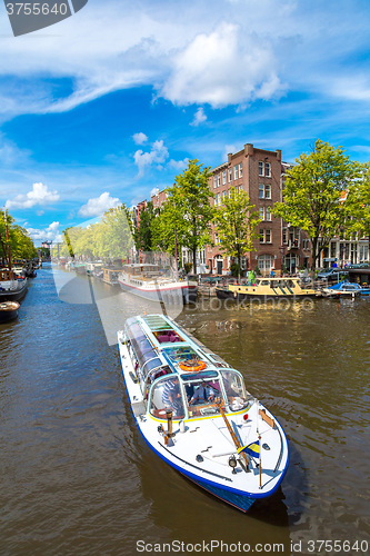 Image of Amsterdam canals and  boats, Holland, Netherlands.