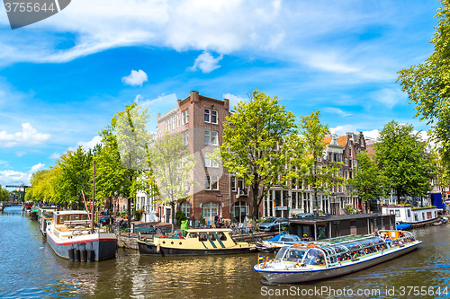 Image of Amsterdam canals and  boats, Holland, Netherlands.