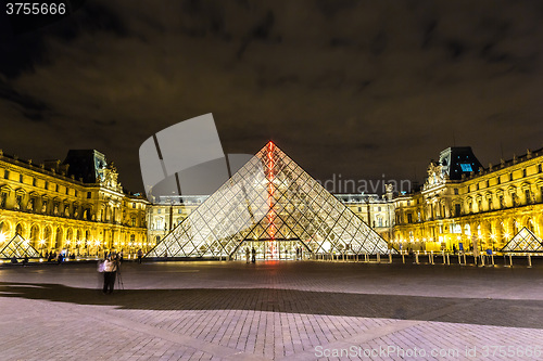 Image of The Louvre at night in Paris