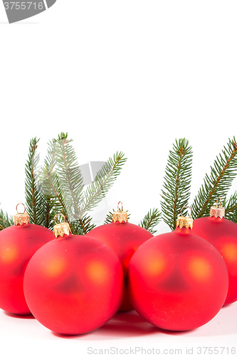 Image of red Christmas balls and fir branch