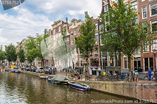 Image of Amsterdam canals and  boats, Holland, Netherlands.