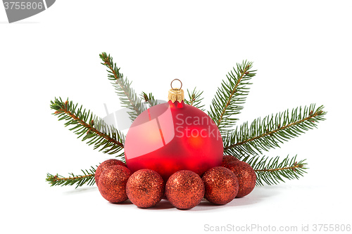 Image of red Christmas balls and fir branch