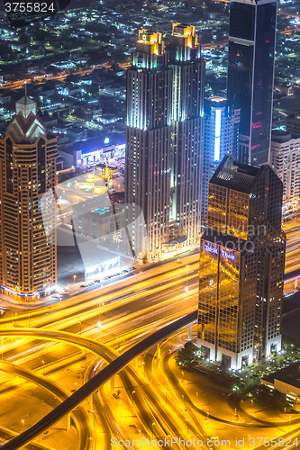 Image of Dubai downtown night scene with city lights,