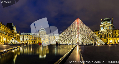 Image of The Louvre at night in Paris