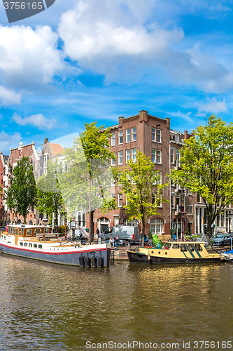 Image of Amsterdam canals and  boats, Holland, Netherlands.