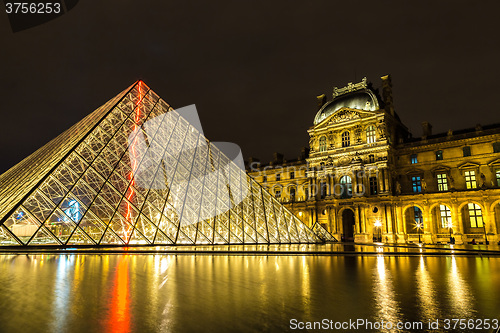 Image of The Louvre at night in Paris