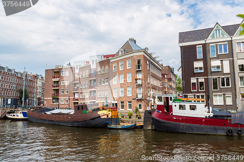 Image of Amsterdam canals and  boats, Holland, Netherlands.