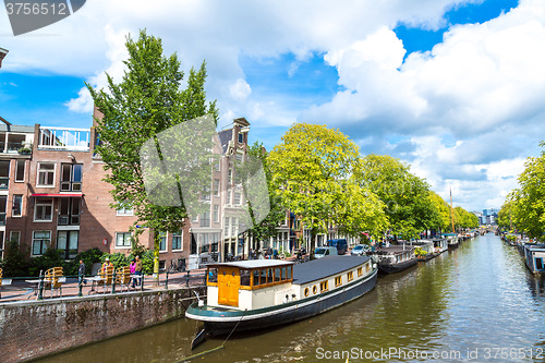 Image of Amsterdam canals and  boats, Holland, Netherlands.