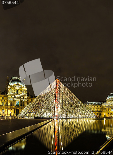 Image of The Louvre at night in Paris