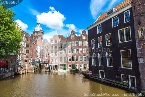 Image of Canal and St. Nicolas Church in Amsterdam