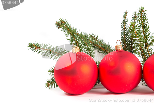 Image of red Christmas balls and fir branch