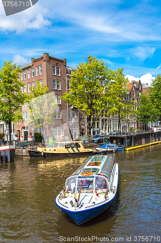 Image of Amsterdam canals and  boats, Holland, Netherlands.