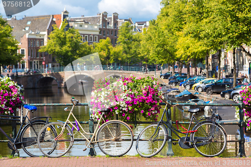 Image of Bicycles on a bridge over the canals of Amsterdam