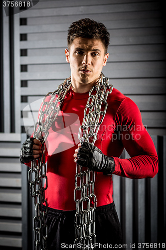 Image of muscular young guy with chain