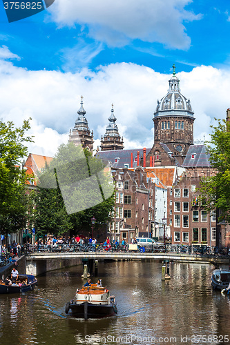 Image of Canal and St. Nicolas Church in Amsterdam