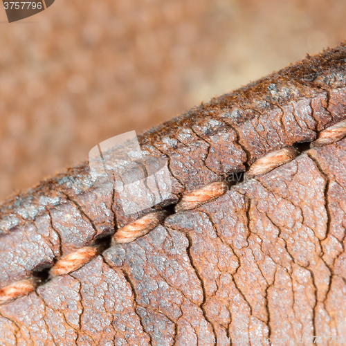 Image of Close-up of old stiches in leather