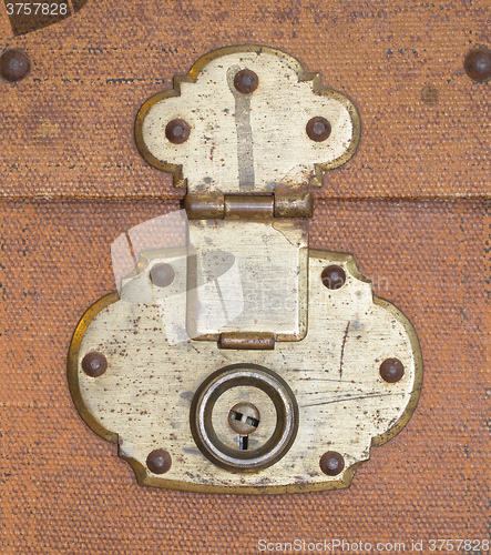 Image of Old canvas trunk lock close up