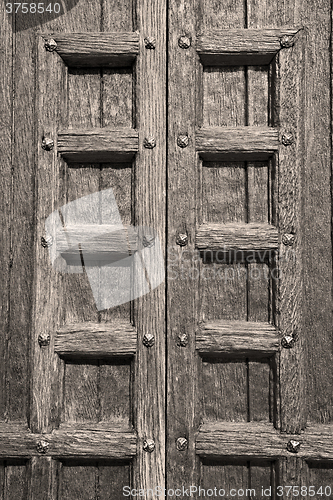 Image of door    in italy old ancian wood and traditional  texture nail