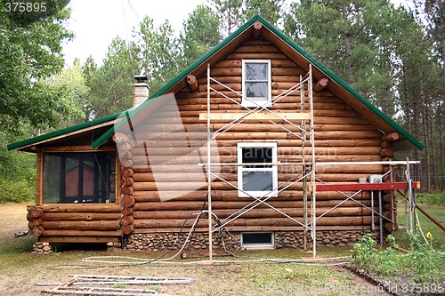 Image of Log Home and Scaffolding