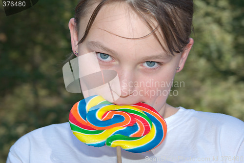 Image of teenager with lollipop