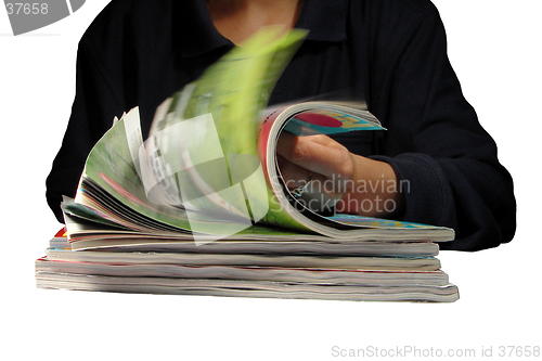 Image of Riffling through magazines