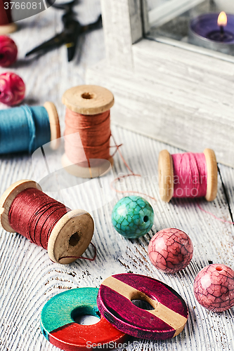 Image of Beads and sewing thread