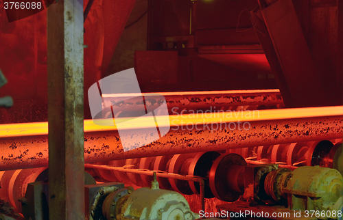 Image of hot steel on conveyor