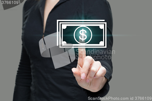 Image of businesswoman presses digital interface dollar sign 