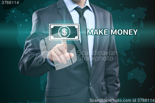 Image of business, technology, internet concept - businessman pressing make money button on virtual screens
