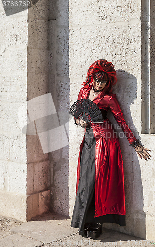 Image of Disguised Woman with a Fan - Venice Carnival 2012