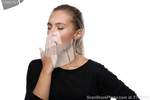 Image of Beautiful woman yawns of boredom 