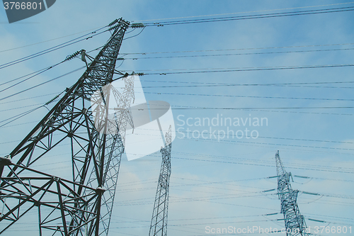 Image of Big frosty power lines among winter.