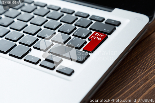 Image of Red button buy now on a laptop